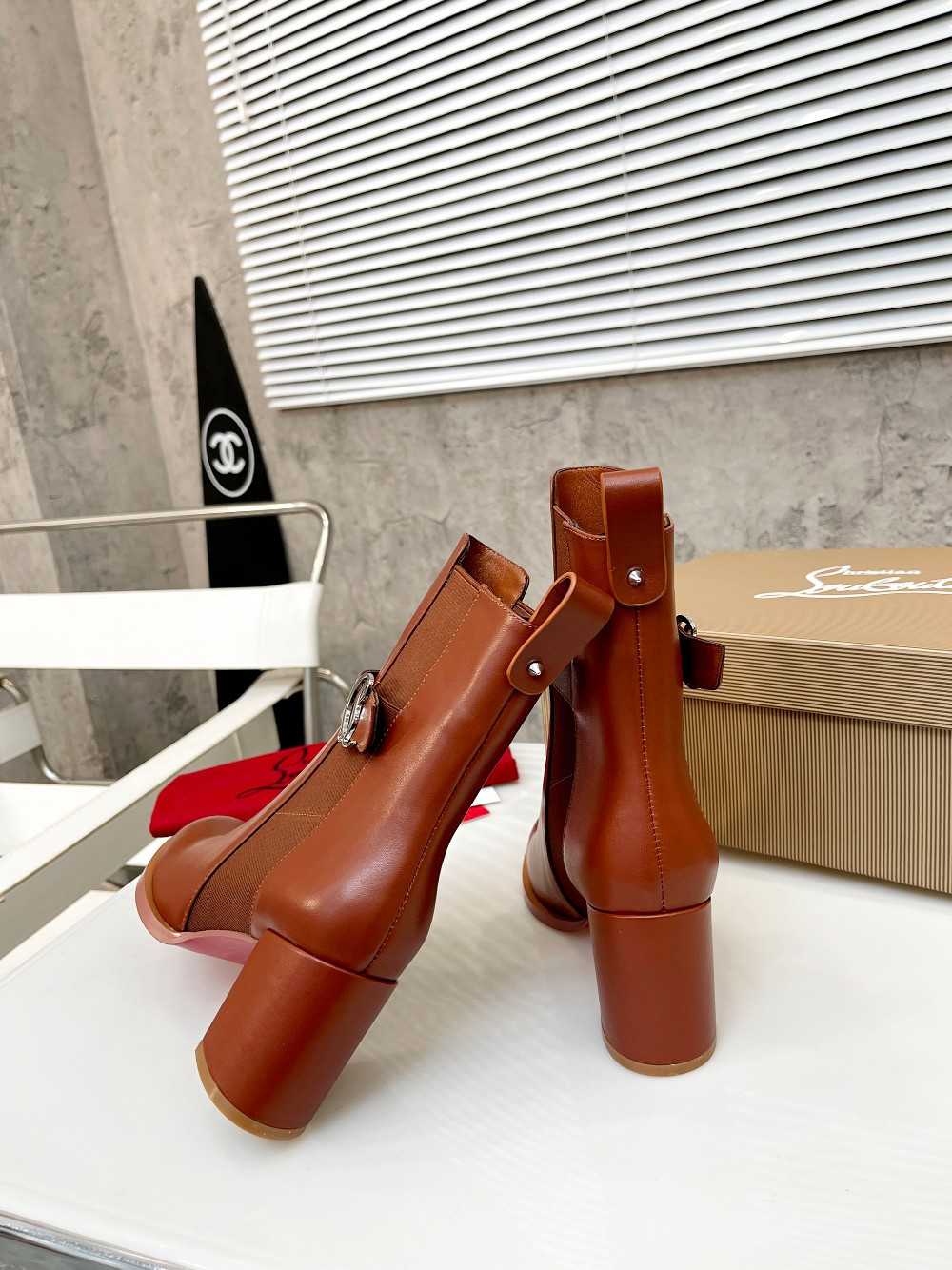 UA Ch**an Louboutin (CL) launched a new collection of chunky heeled platform boots