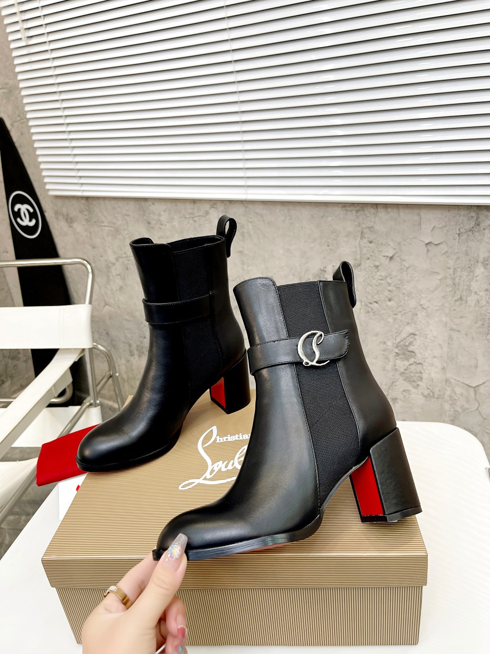 UA Ch**an Louboutin (CL) launched a new collection of chunky heeled platform boots
